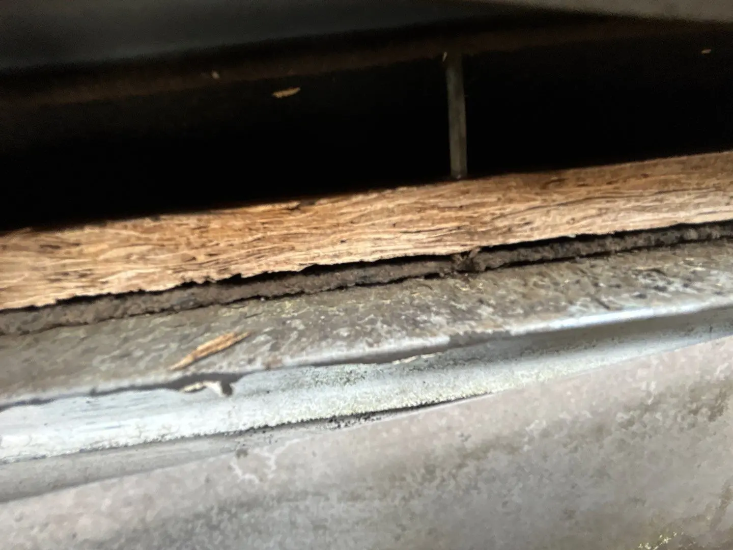 Damaged roof decking and fascia board caused by prolonged moisture from failing gutter system.