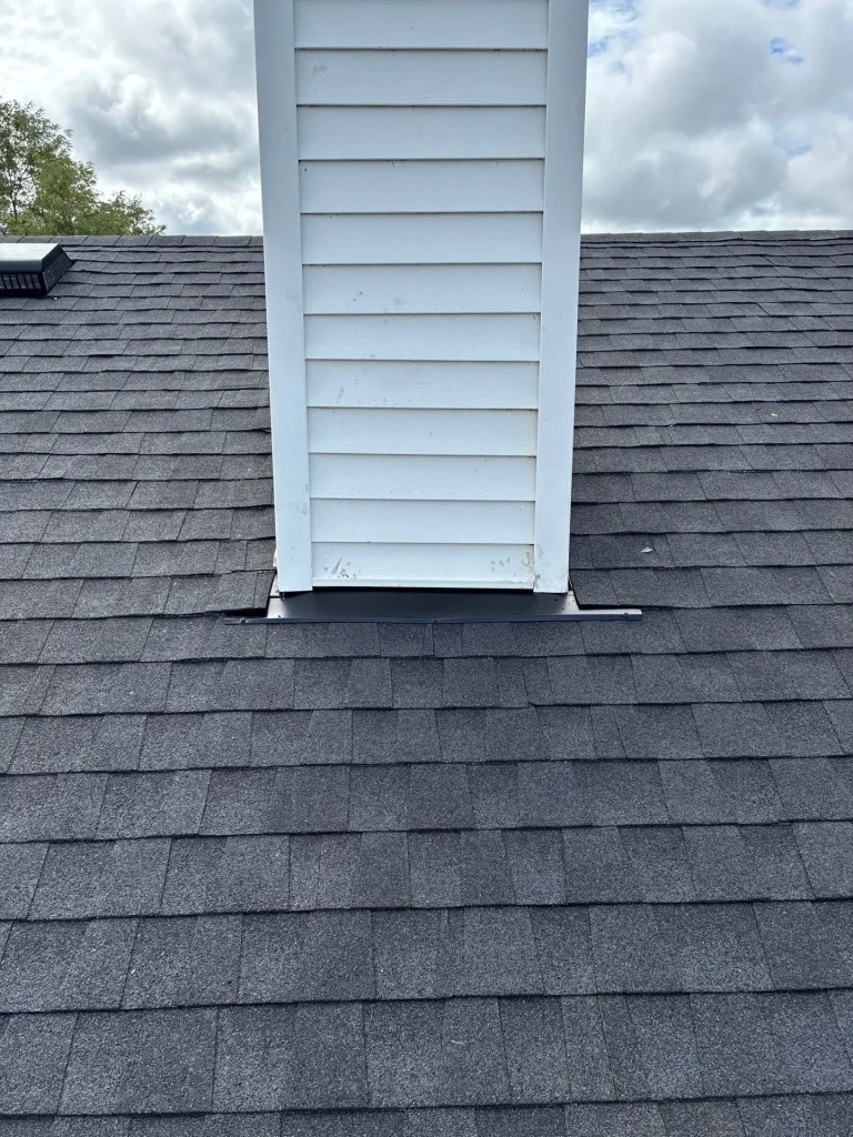 Damaged roof flashing around exterior vent on residential roof in Lexington Kentucky