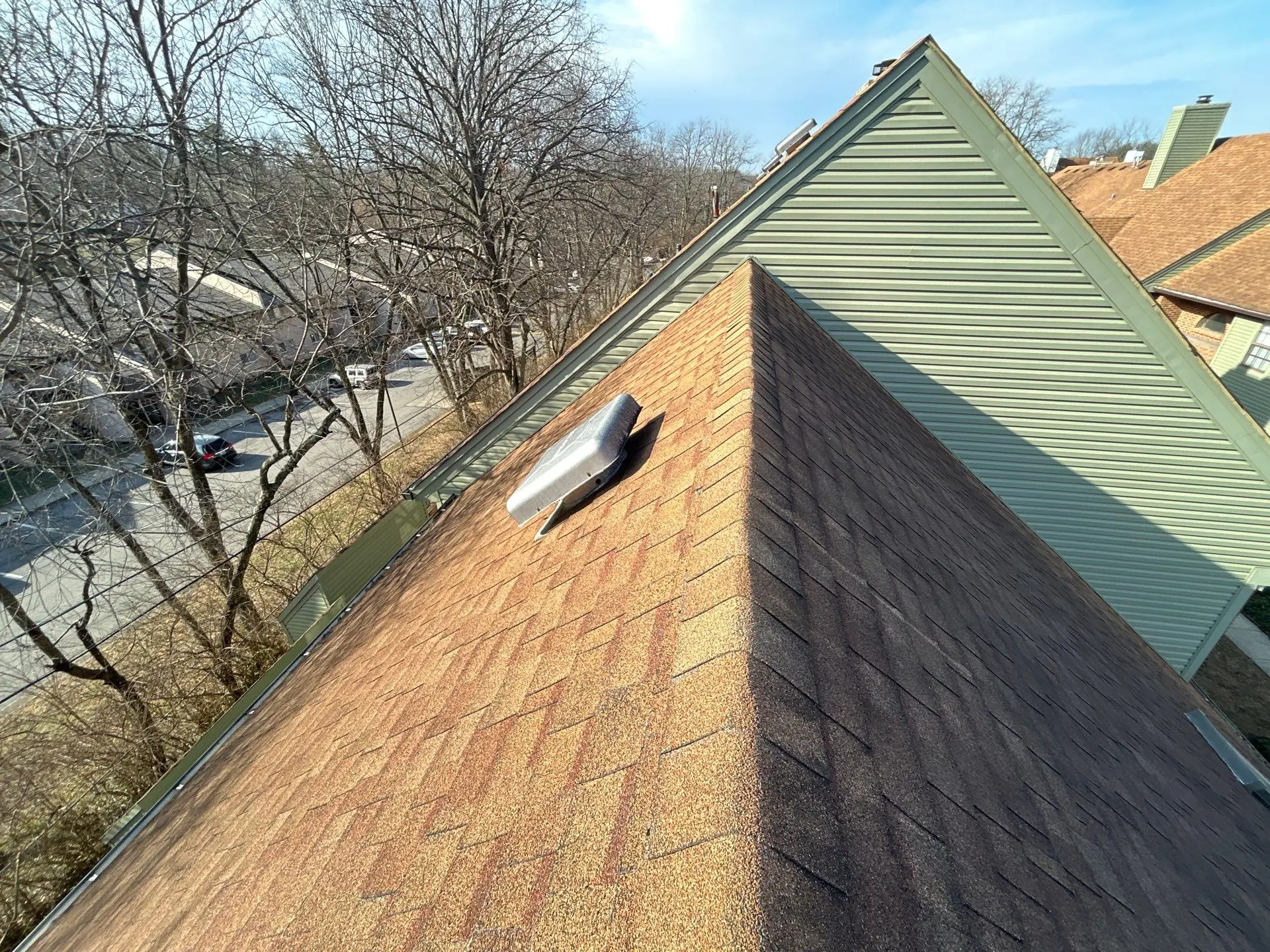Asphalt shingle roof with roof vent showing shingle wear during residential roof inspection in Lexington KY