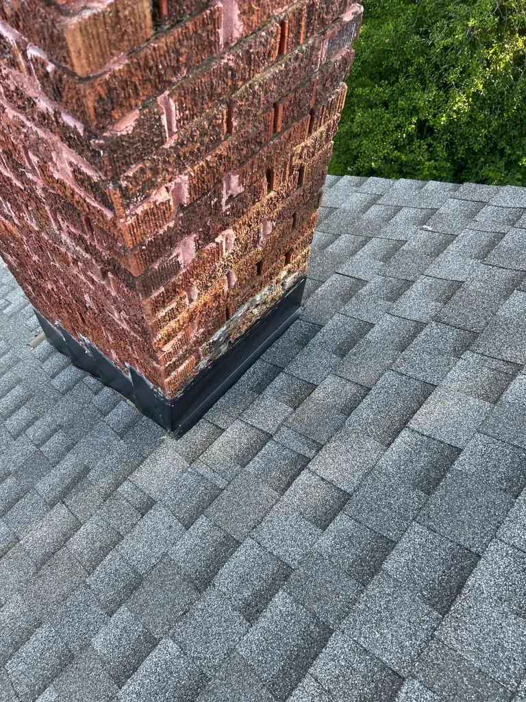 New chimney flashing installed on asphalt shingle roof in Lexington KY residential home