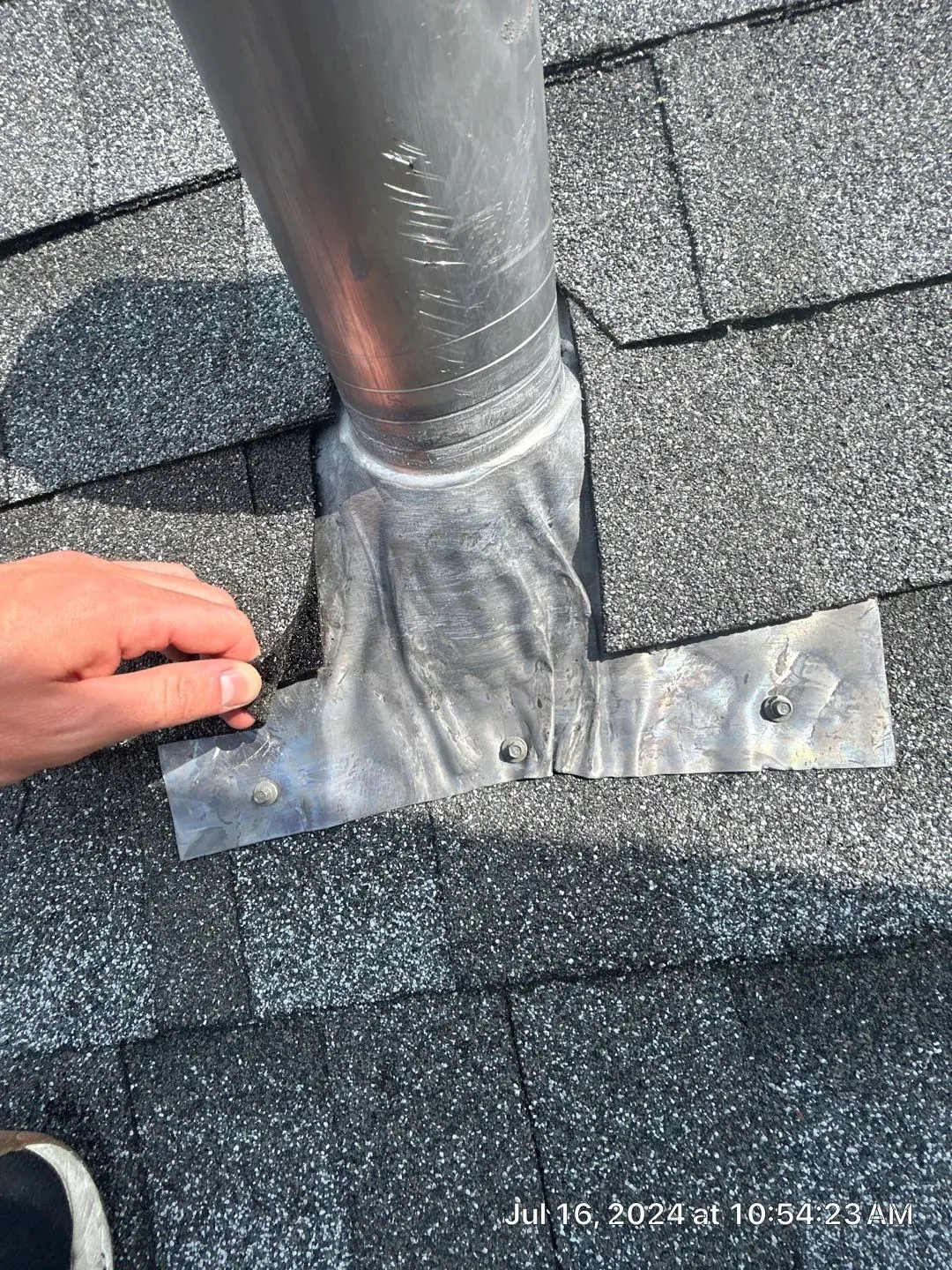 Roof penetration repair around vent pipe in Lexington KY with damaged flashing and shingles