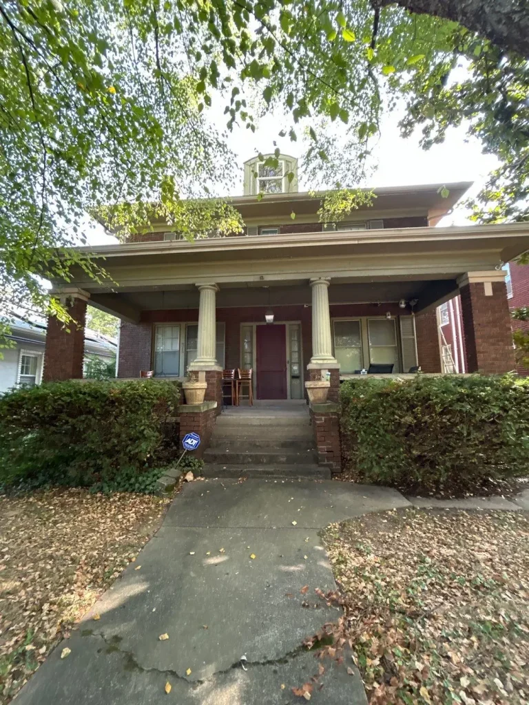 Front view of brick home in Richmond KY with gutter system along roofline for drainage