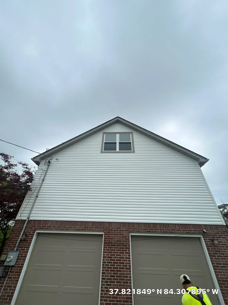 Full exterior view of white vinyl siding on gable wall in Richmond KY