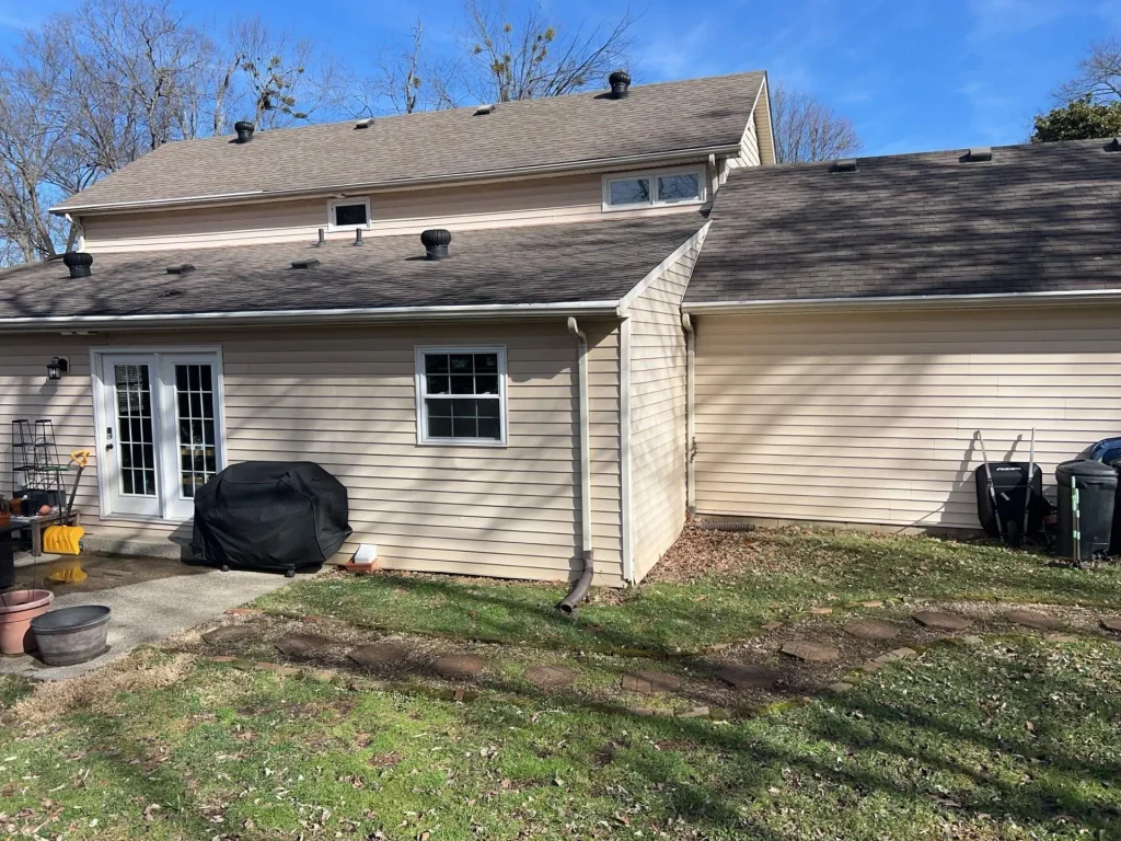 Downspout draining water near foundation causing pooling and erosion on Richmond KY home