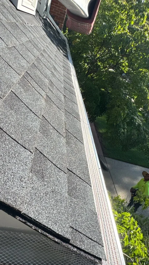Micro mesh gutter guards installed along asphalt shingle roof edge on Richmond KY home with trees nearby
