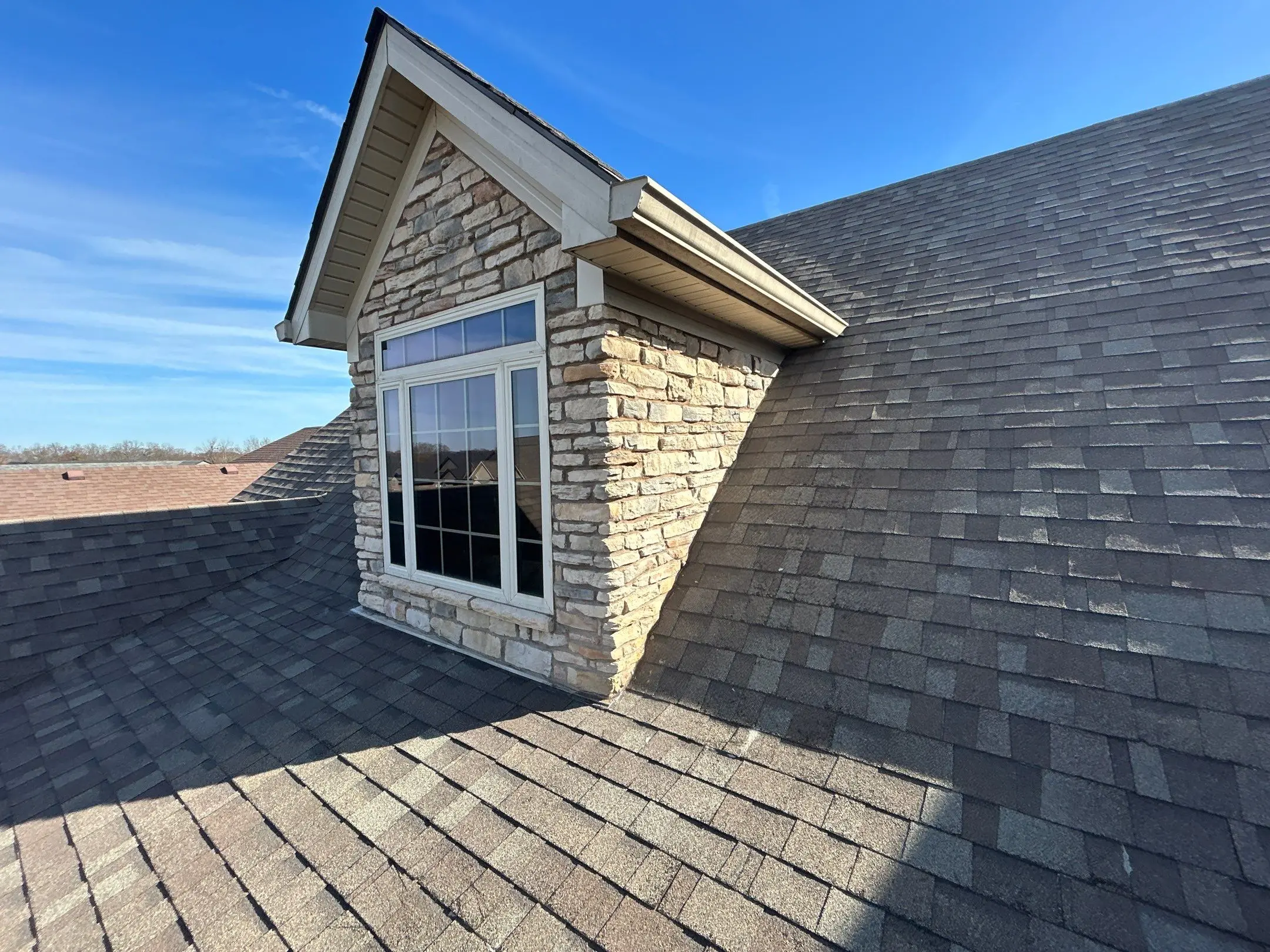 Roof dormer with asphalt shingles and siding detail on residential home in Richmond KY