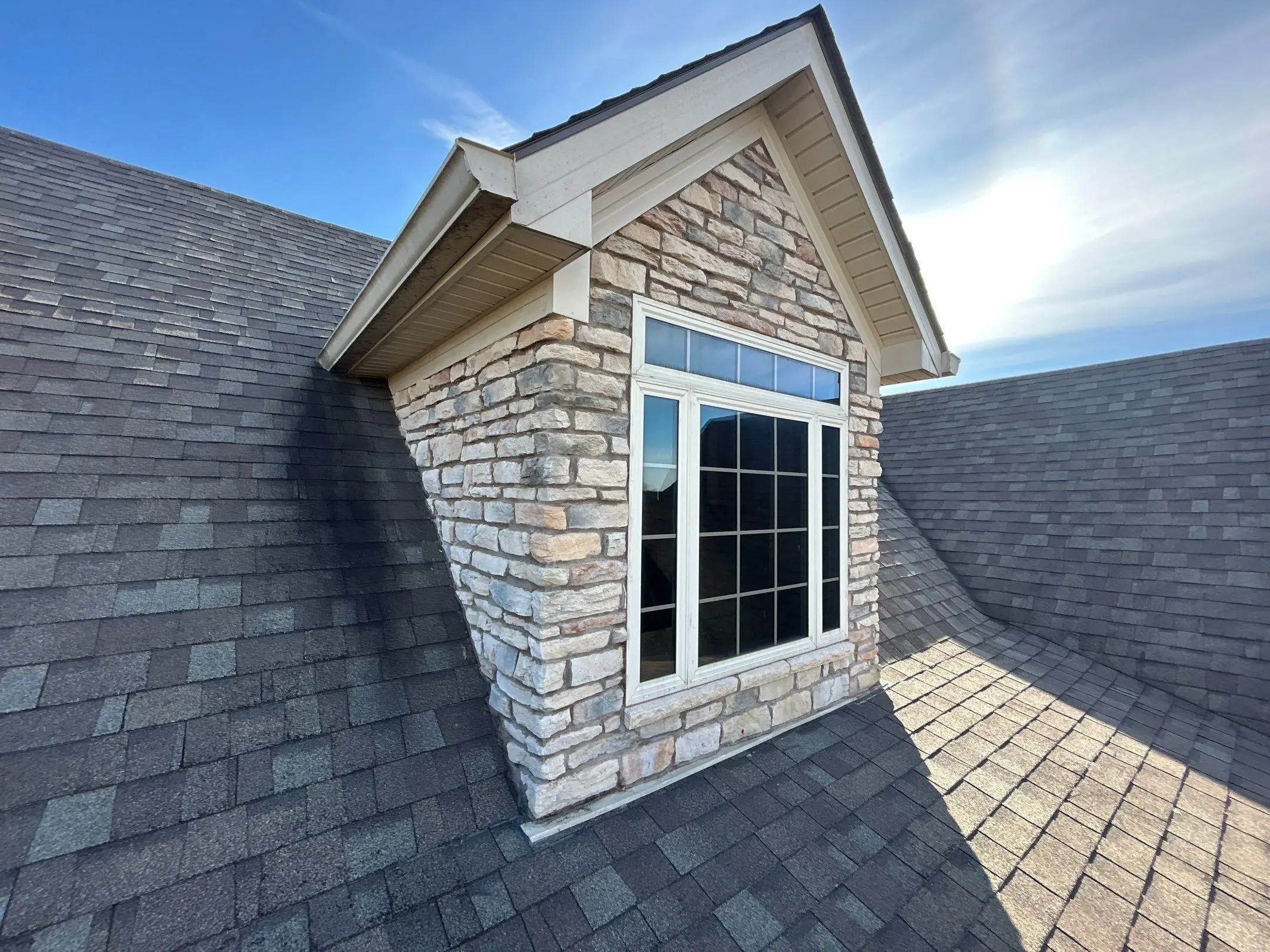 Roof dormer with asphalt shingles on Richmond KY home showing proper installation