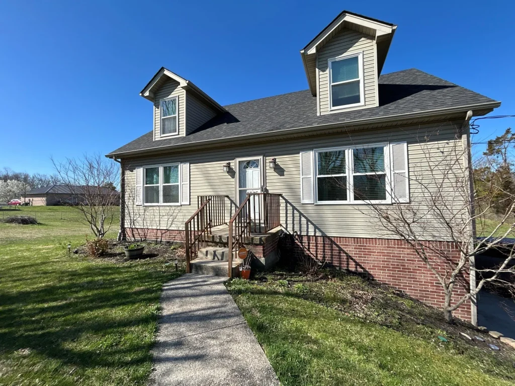 New asphalt shingle roof replacement on residential home in Richmond KY with updated roof and exterior view