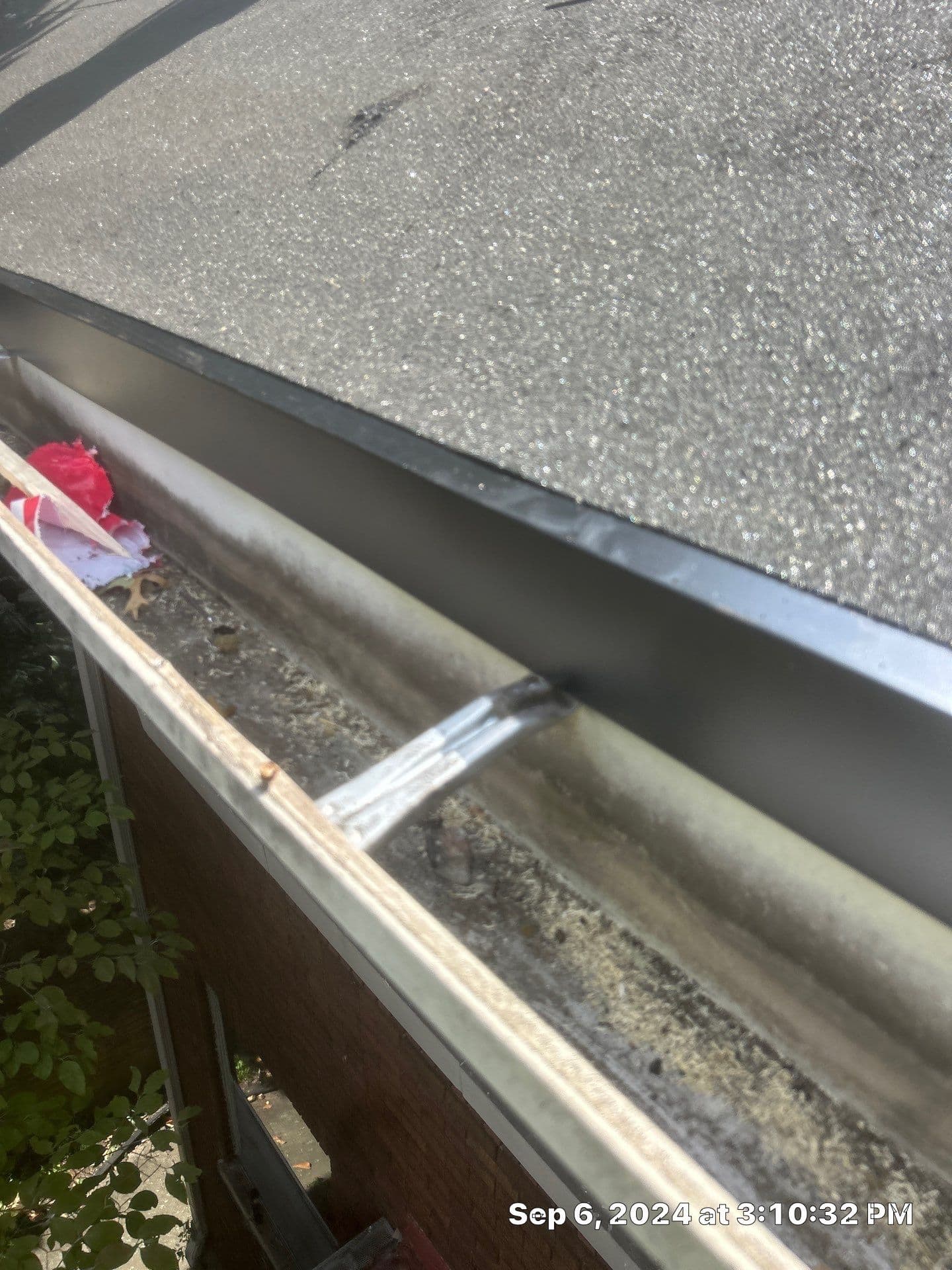 Rust forming inside gutter system on Richmond KY home showing metal deterioration