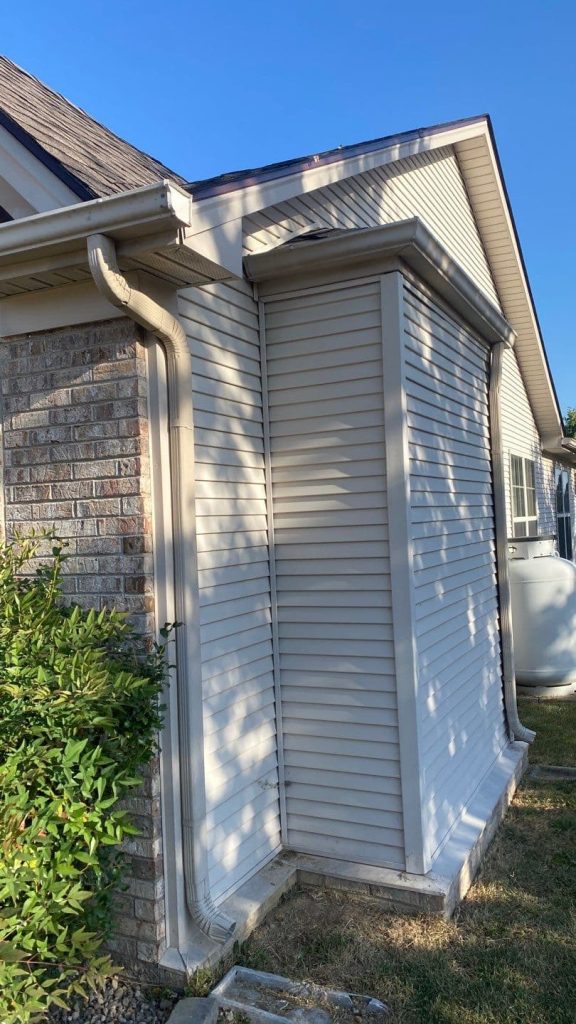 Seamless gutter and downspout system installed on a Lexington KY home exterior