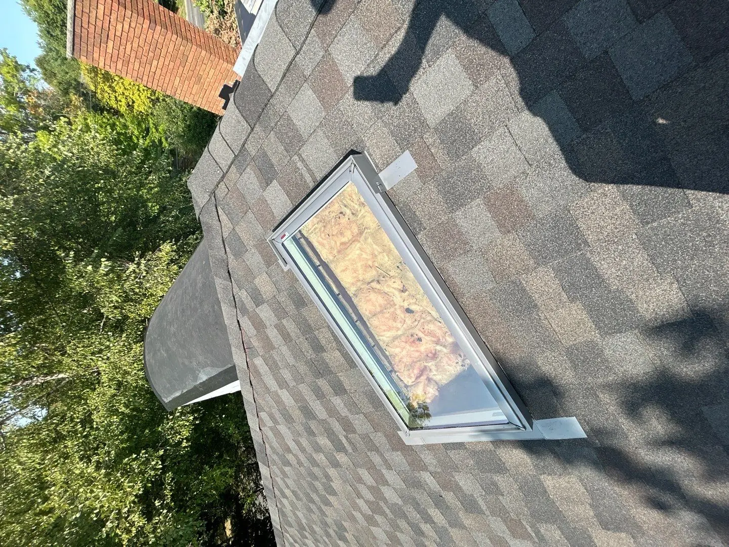 Residential skylight installed on asphalt shingle roof in Richmond KY with visible flashing and surrounding shingles