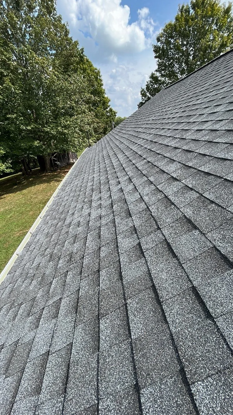 Steep gray architectural shingle roof slope on a home in Irvine, KY