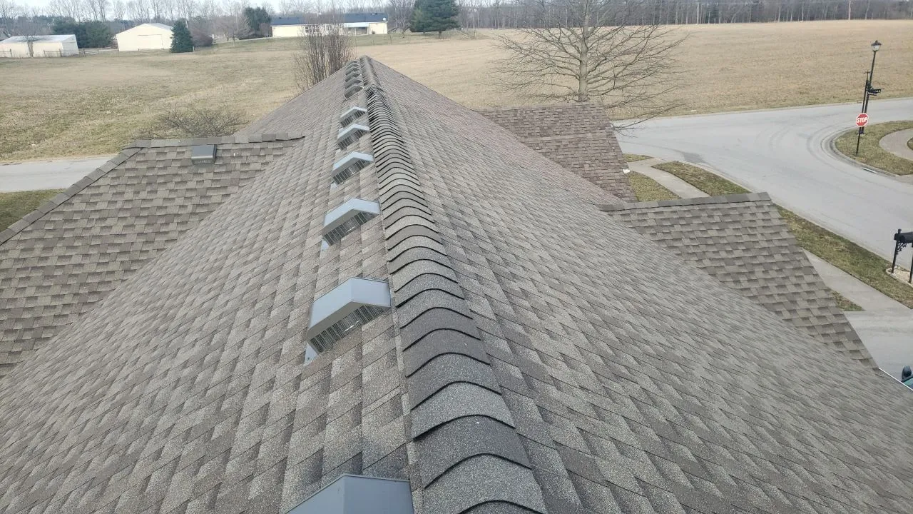 Tan architectural shingle roof ridge with cap shingles and box vents in Mt. Sterling, KY