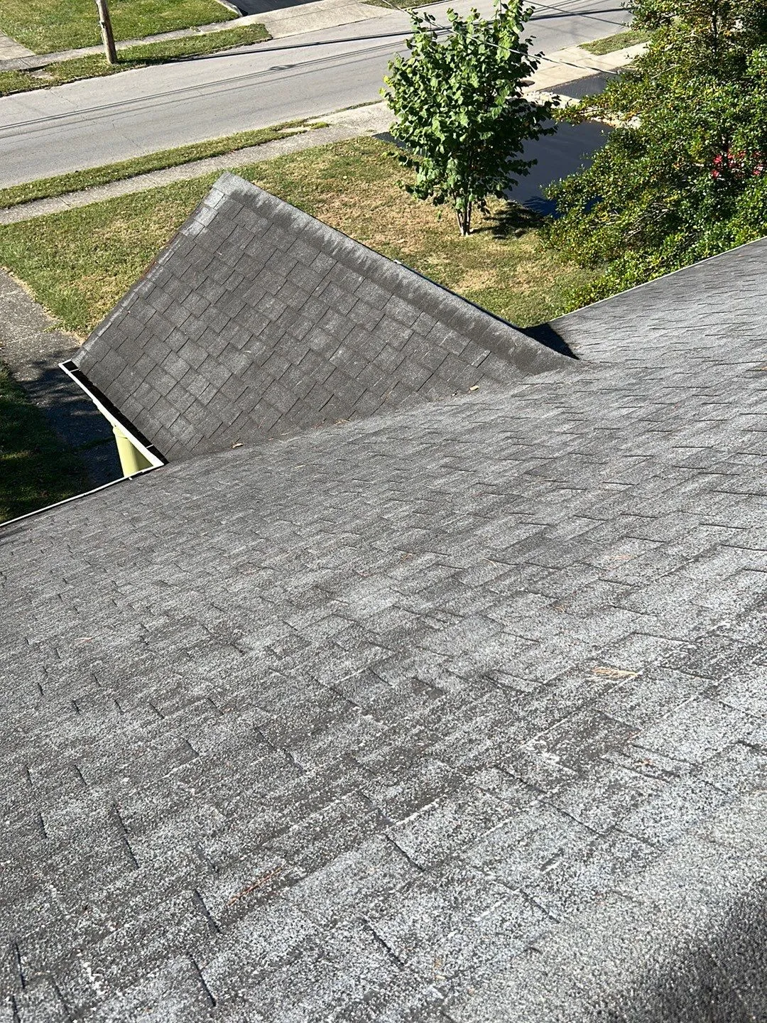 Gray architectural shingle roof slopes above a street in Mt. Sterling, KY