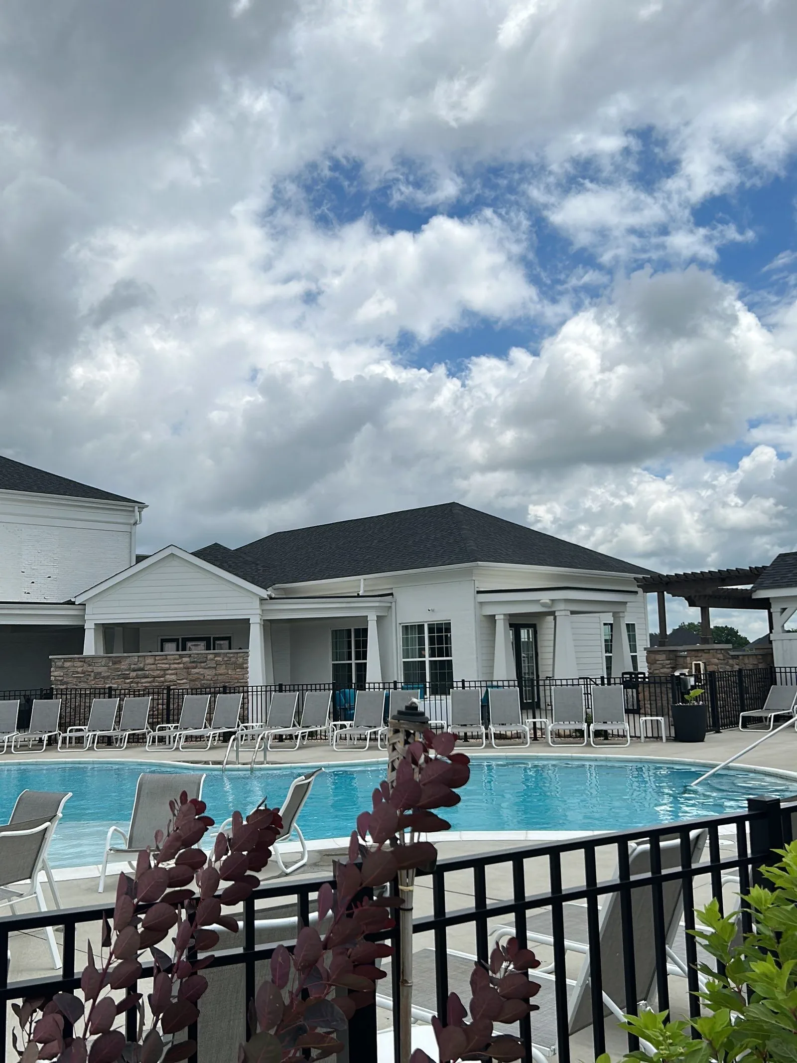 Clubhouse and pool area of a Louisville, KY apartment community with a new roof by AIC Roofing and Construction