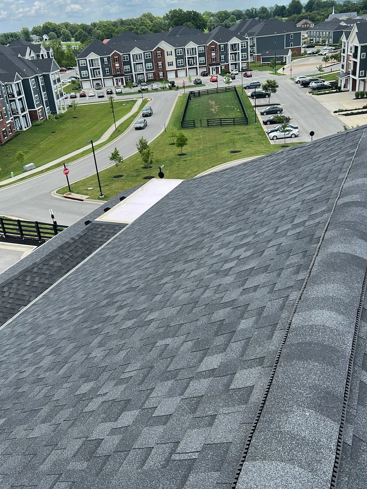 Aerial view of a Louisville, KY apartment community with new roofing by AIC Roofing and Construction