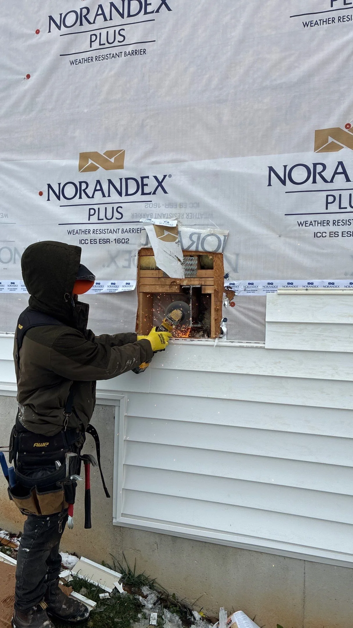 AIC Roofing and Construction crew installing new siding on a Louisville, KY home