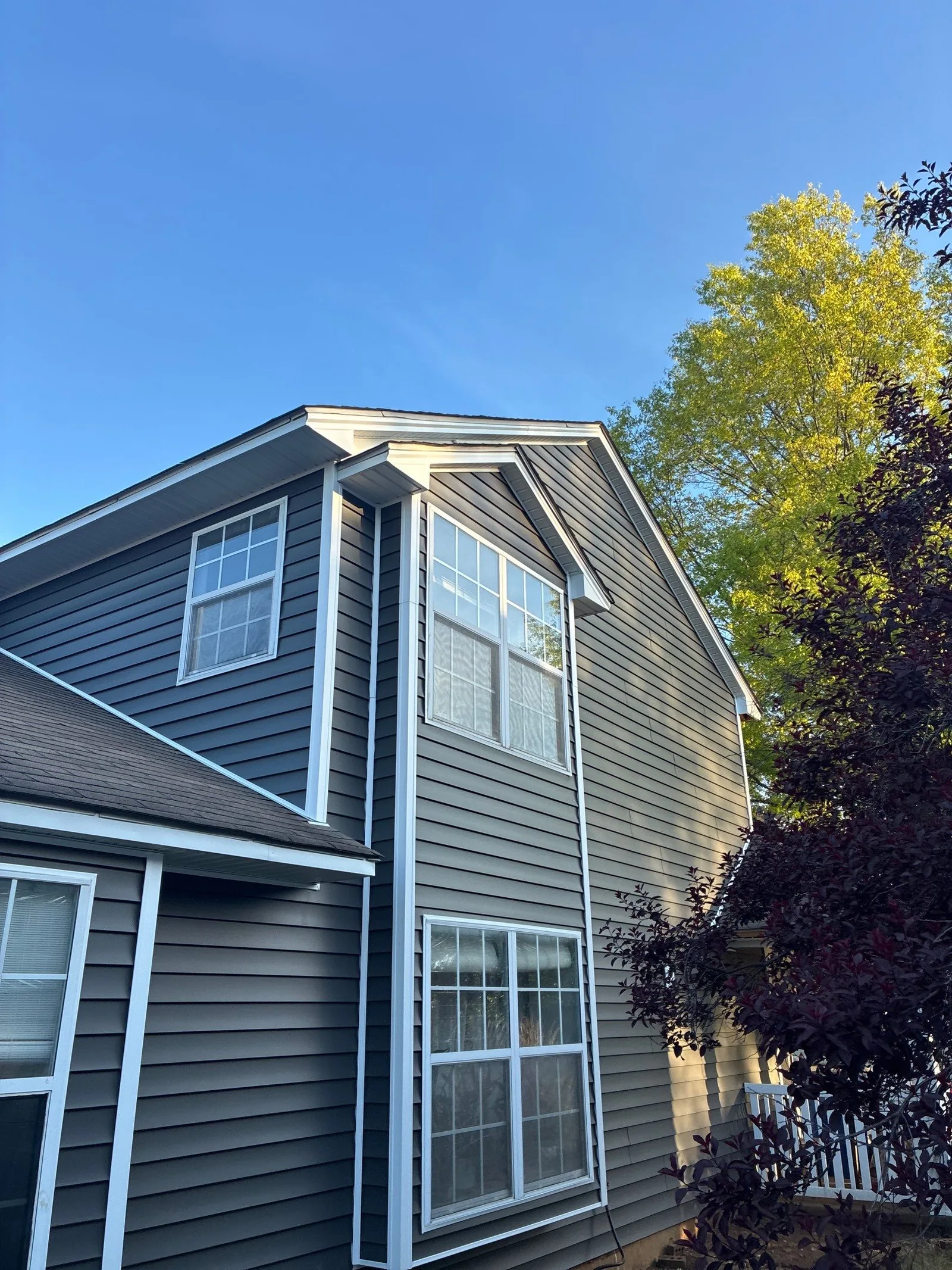 New siding improving curb appeal on a two-story Lexington, KY home