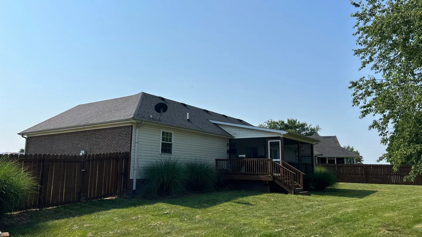 Single-story home with a gray shingle roof and screened porch in Lancaster, KY