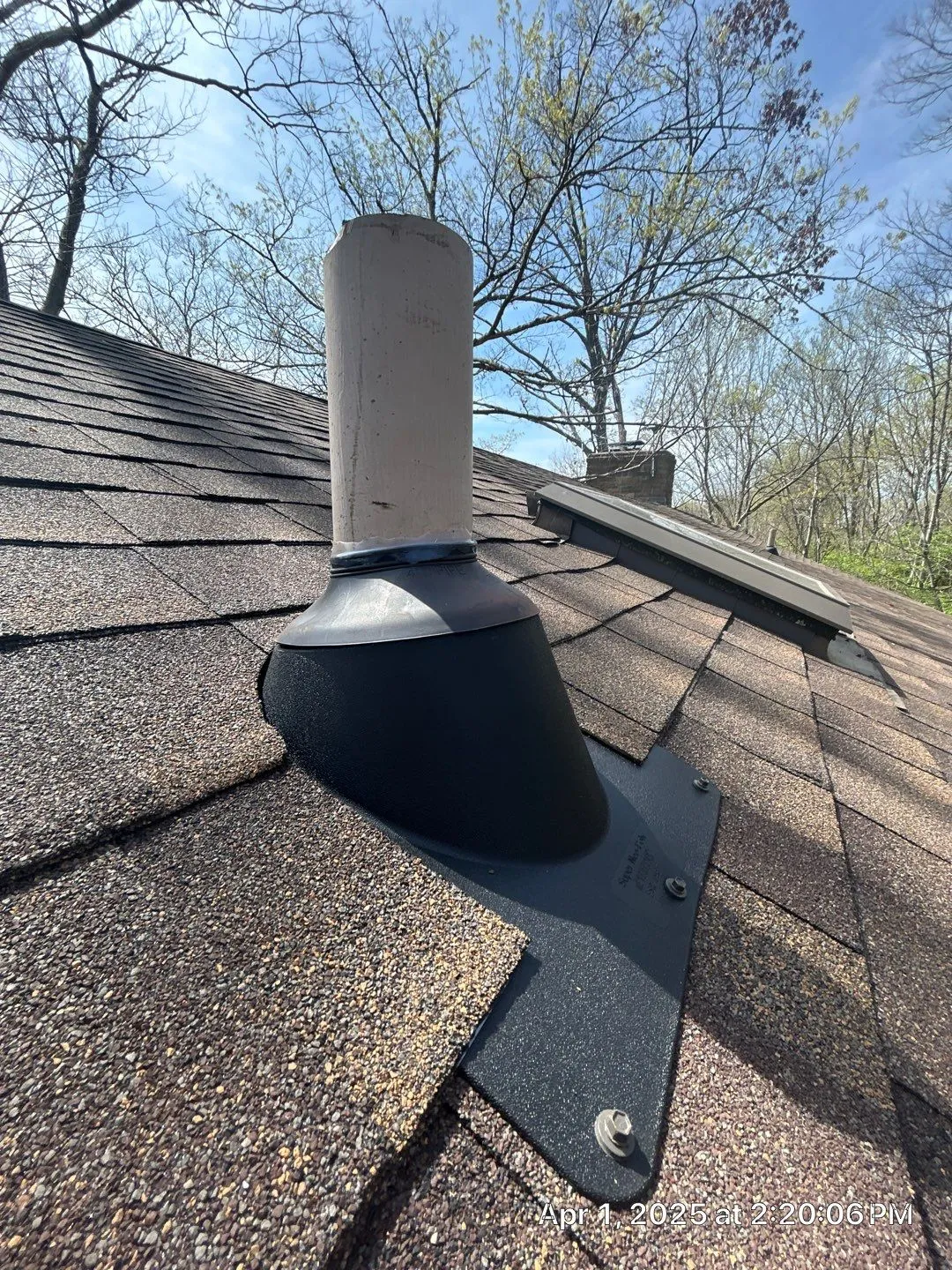 New black pipe boot flashing around a vent pipe on a brown shingle roof in Lancaster, KY
