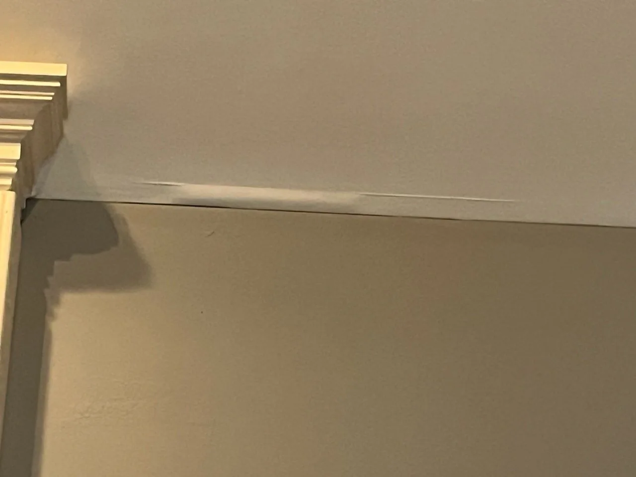 Water staining and sagging at an interior ceiling from a roof leak in a Waco, KY building.