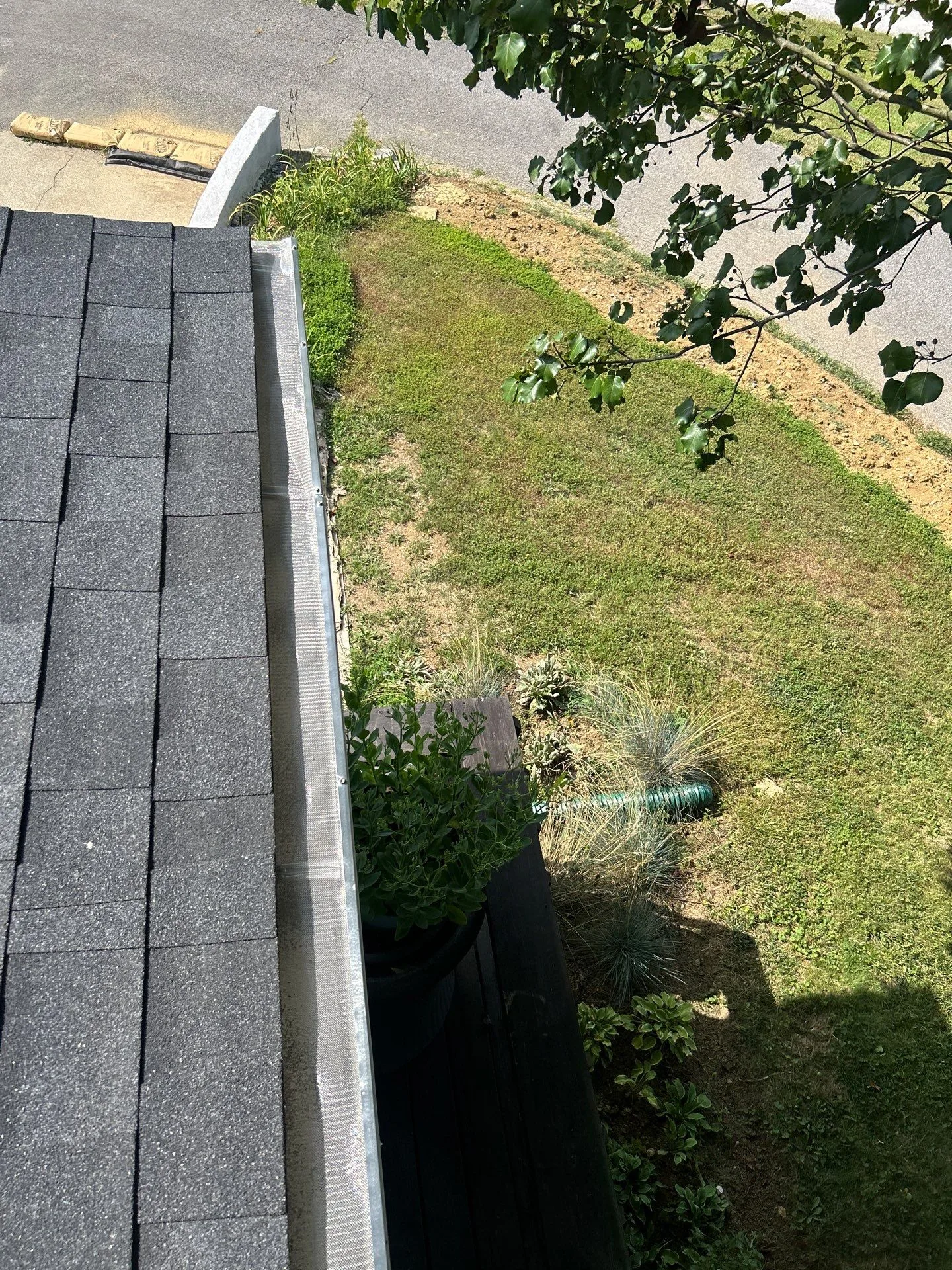Mesh gutter guard installed along a shingle roof on a Lancaster, KY home.