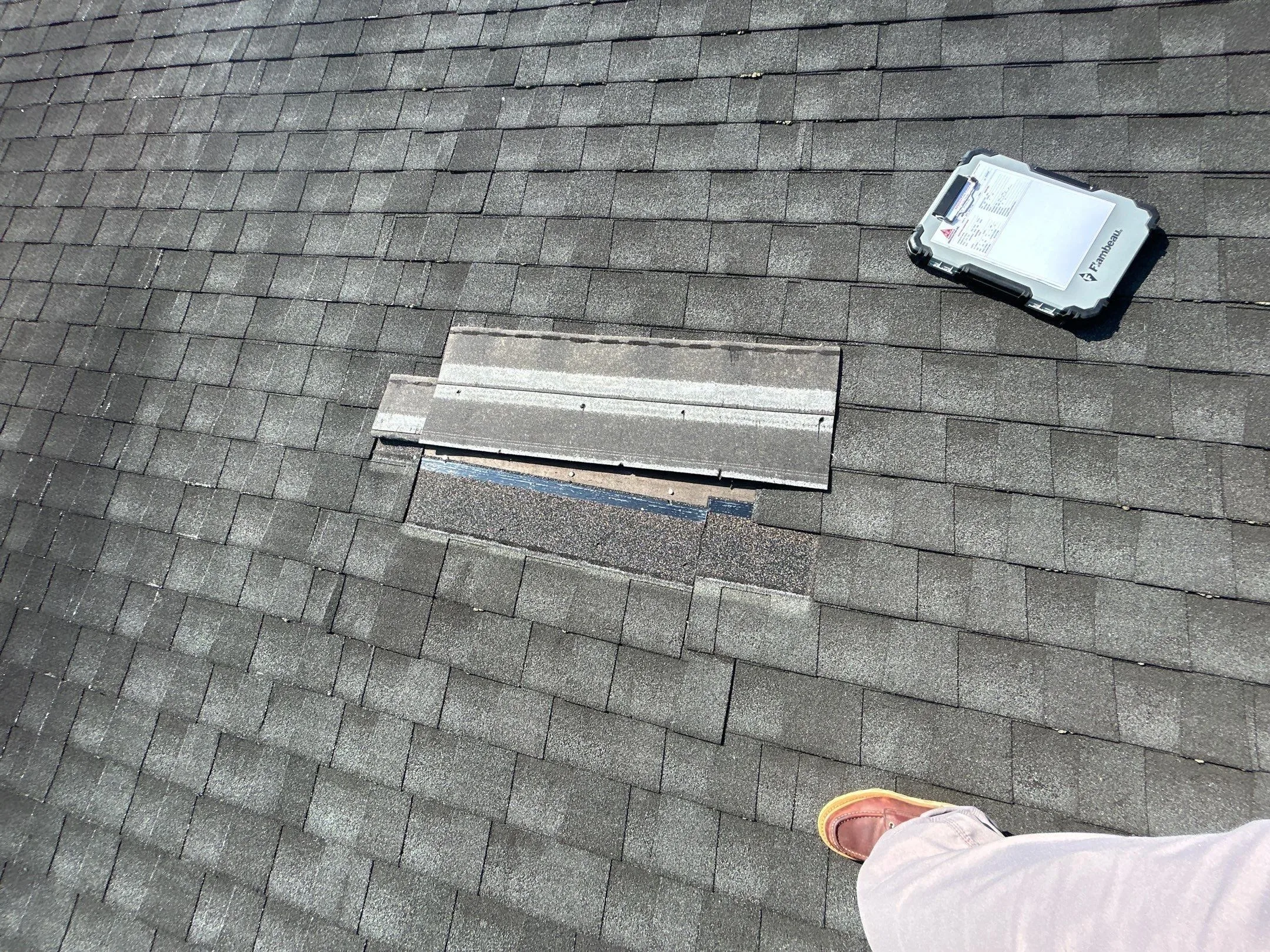 Damaged shingle area marked for repair on a Waco, KY roof.