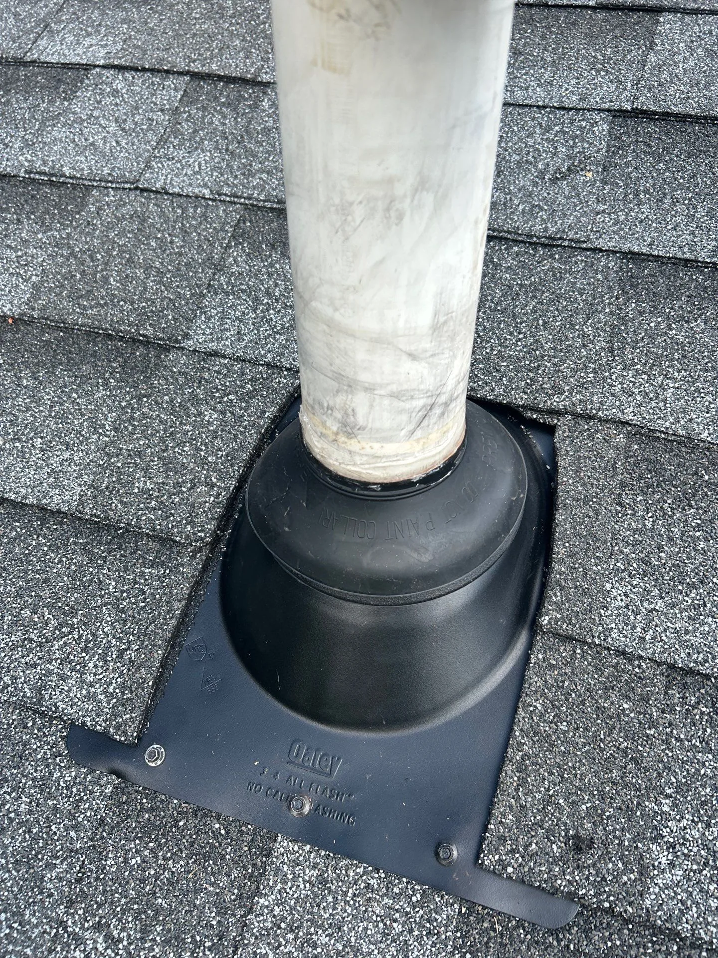 New black pipe boot flashing around a vent pipe on a Waco, KY roof.