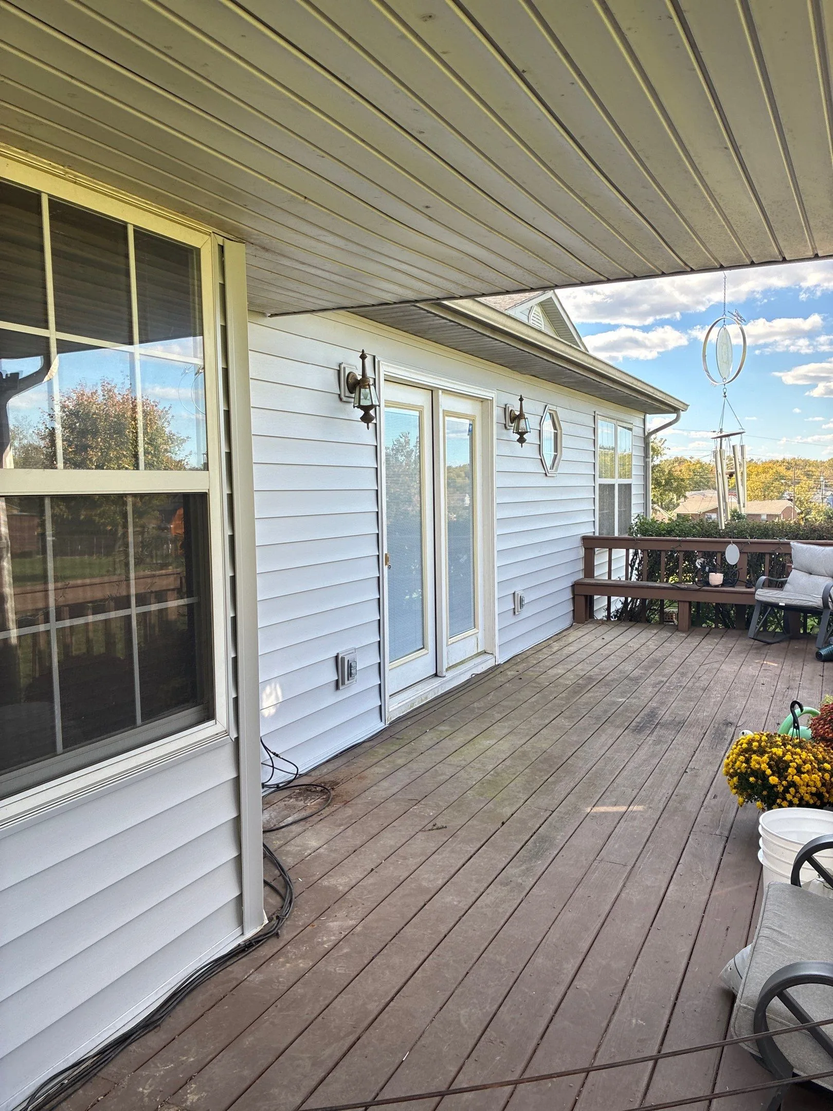 White vinyl siding along a covered back deck of a Lancaster, KY home.