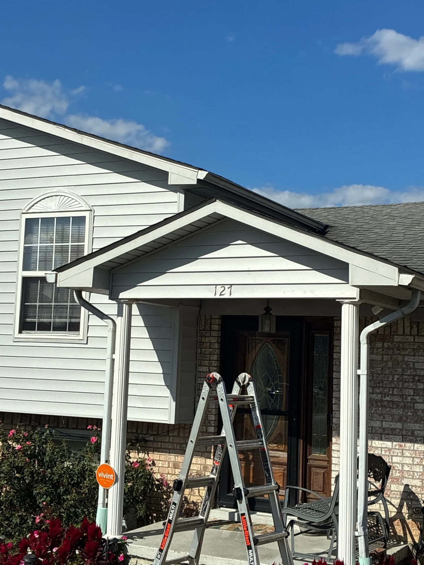 New light vinyl siding on a covered entryway gable of a Waco, KY home.